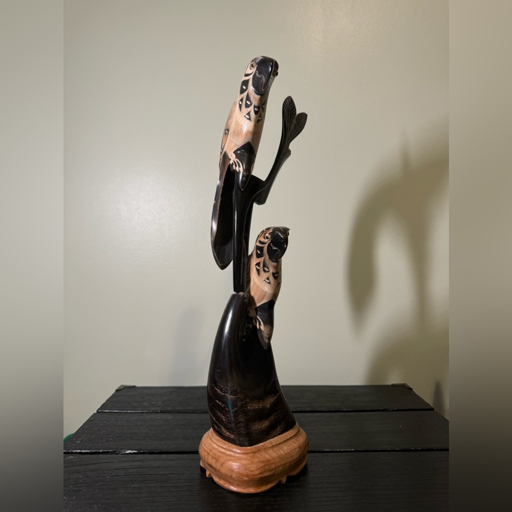Black horn carved parrots statue